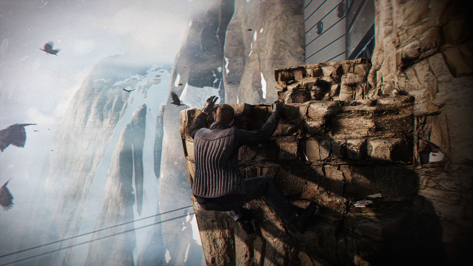 James Bond free-climbing a sheer cliff face above a snowbound mountain valley in 007 First Light.