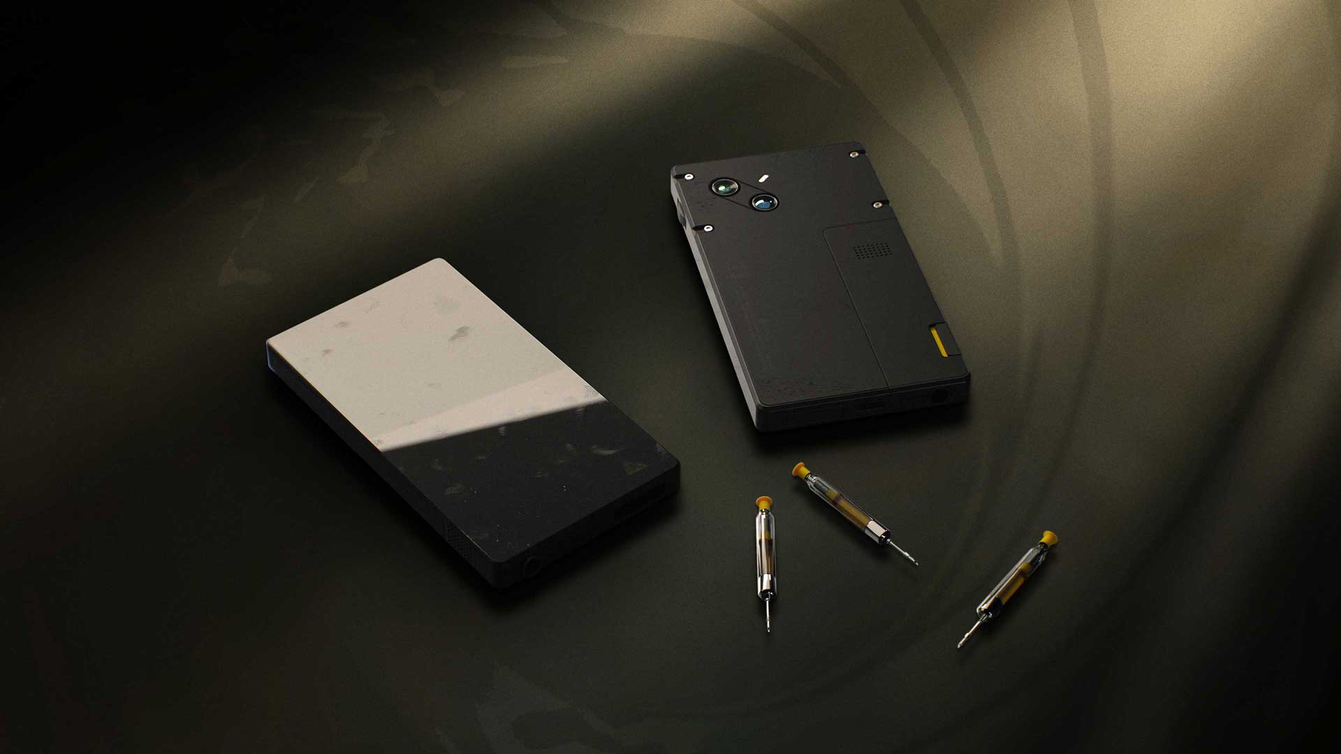 Official 007 First Light render of Bond's gadget phone shown with three dart cartridges.