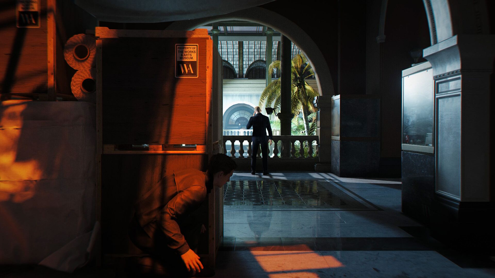 Bond using crates for cover in a grand marble hall as an enemy patrols ahead. — a scene from the 007 First Light chapters