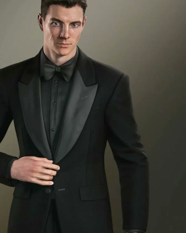 James Bond in the Casino Suit, a fitted black tuxedo with a black bow tie, in 007 First Light.